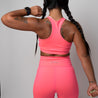Racerback sports bra with seam detailing | Neon Pink